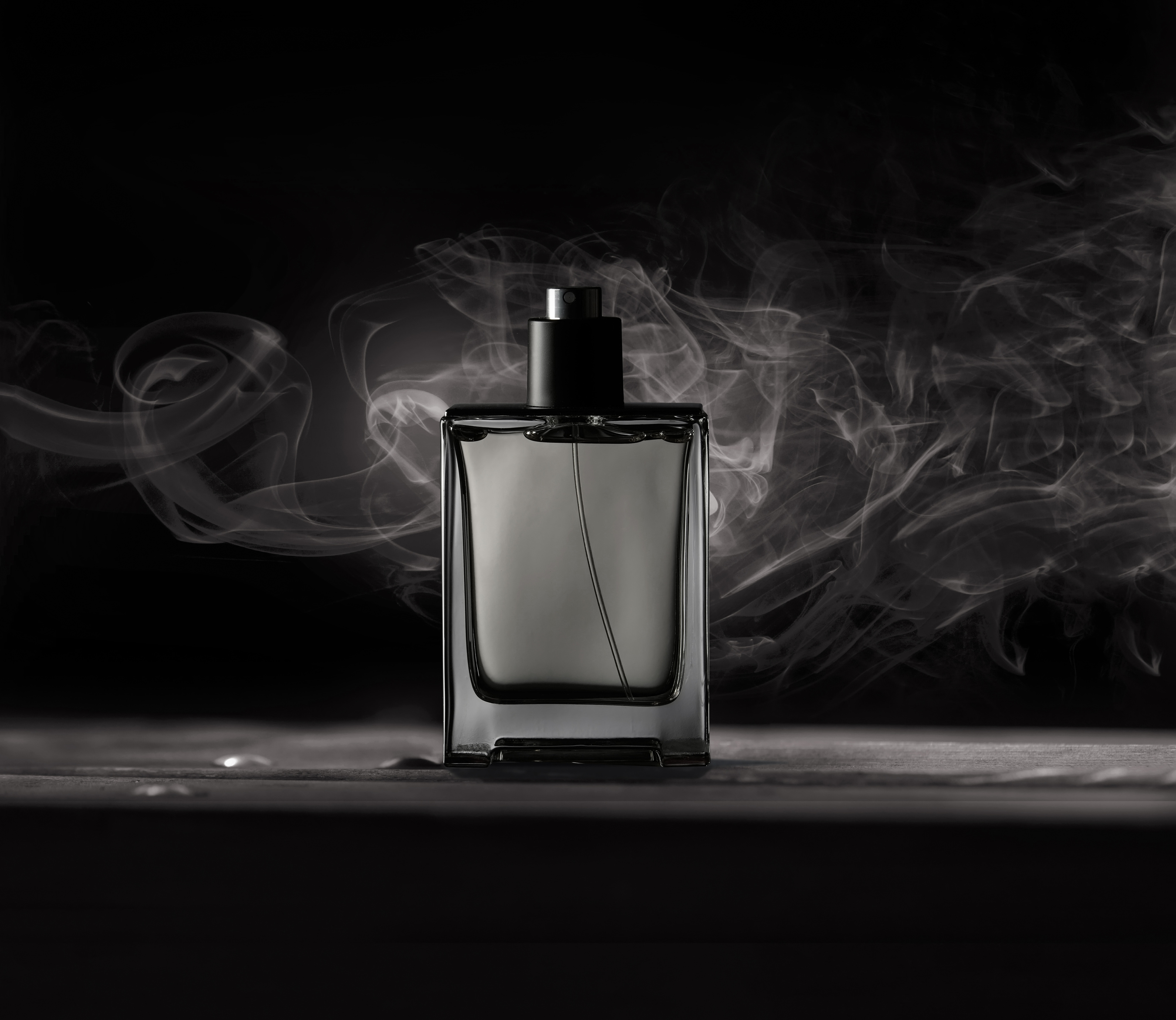 Bottle of men's Fragrance on a dark background