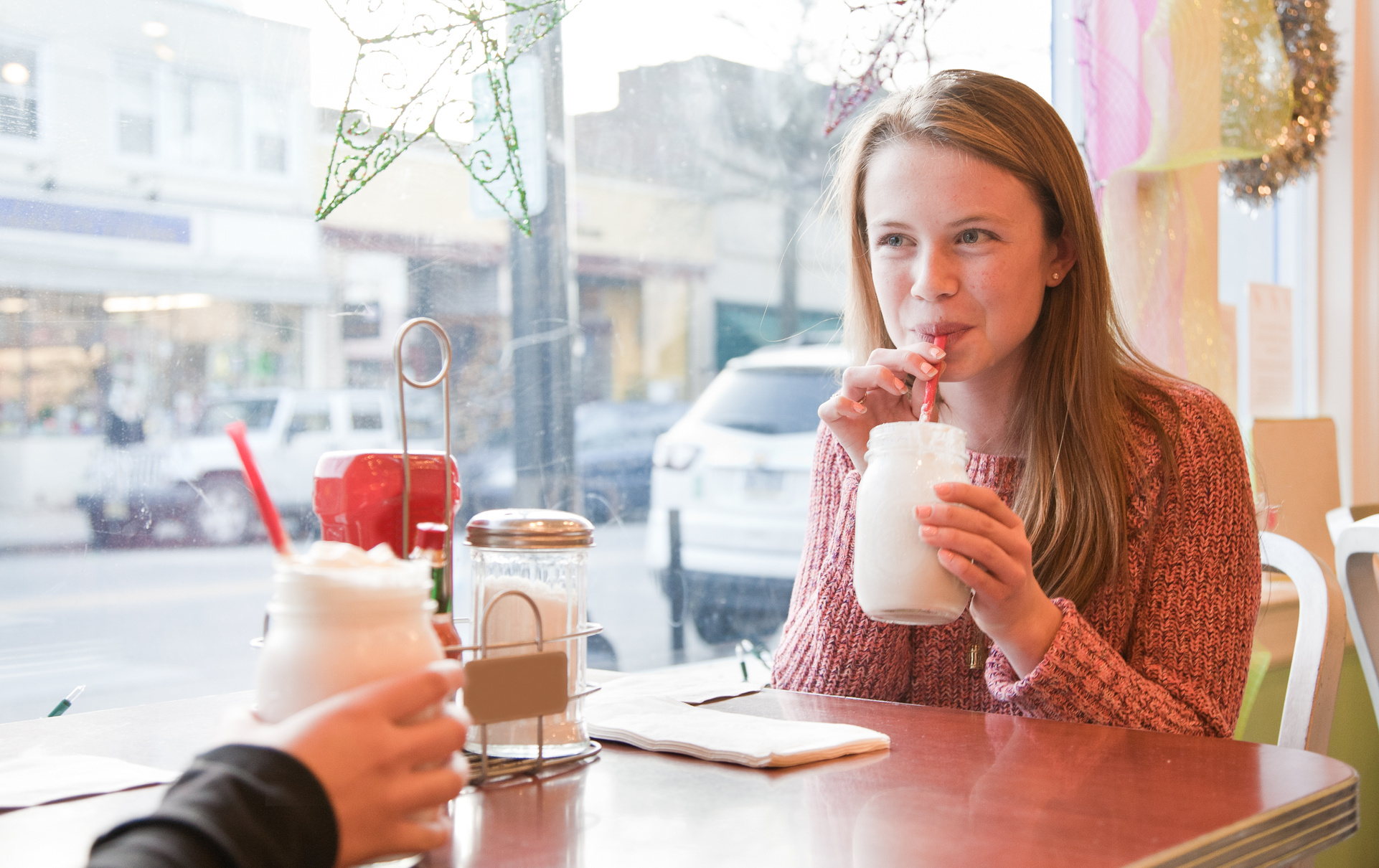 Teenage Girl drinking a milkshake