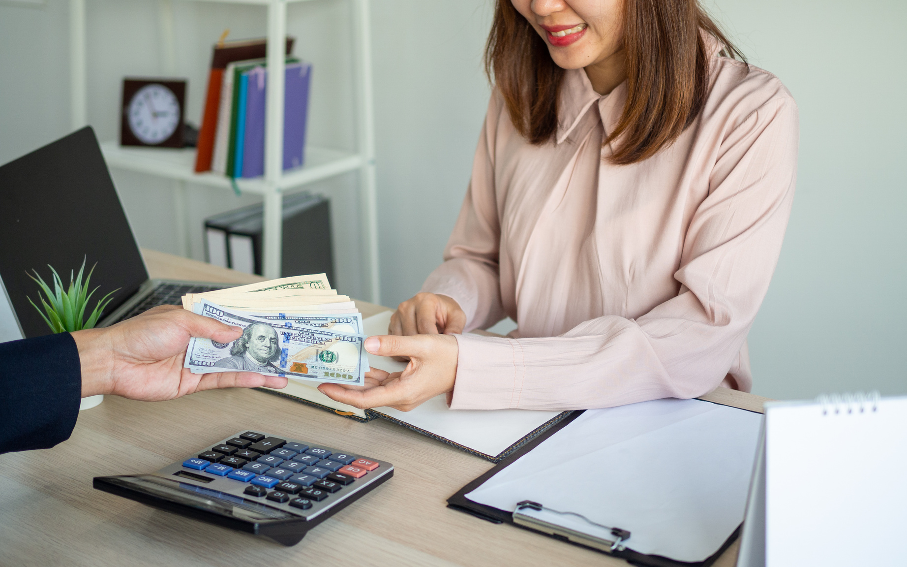 Executives providing salary for young Asian staff. Receiving annual bonuses for salaried employees